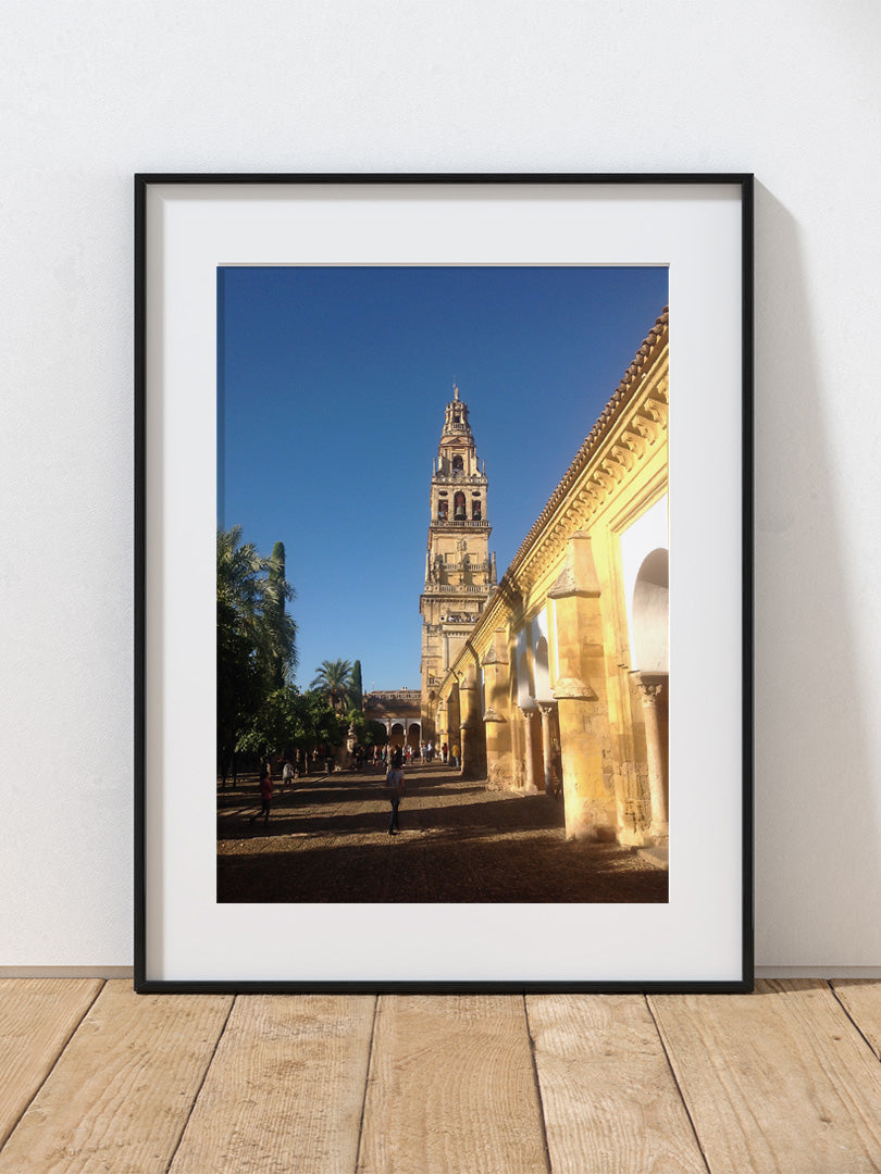 A photograph of the Red Mosque courtyard against a blue sky.
